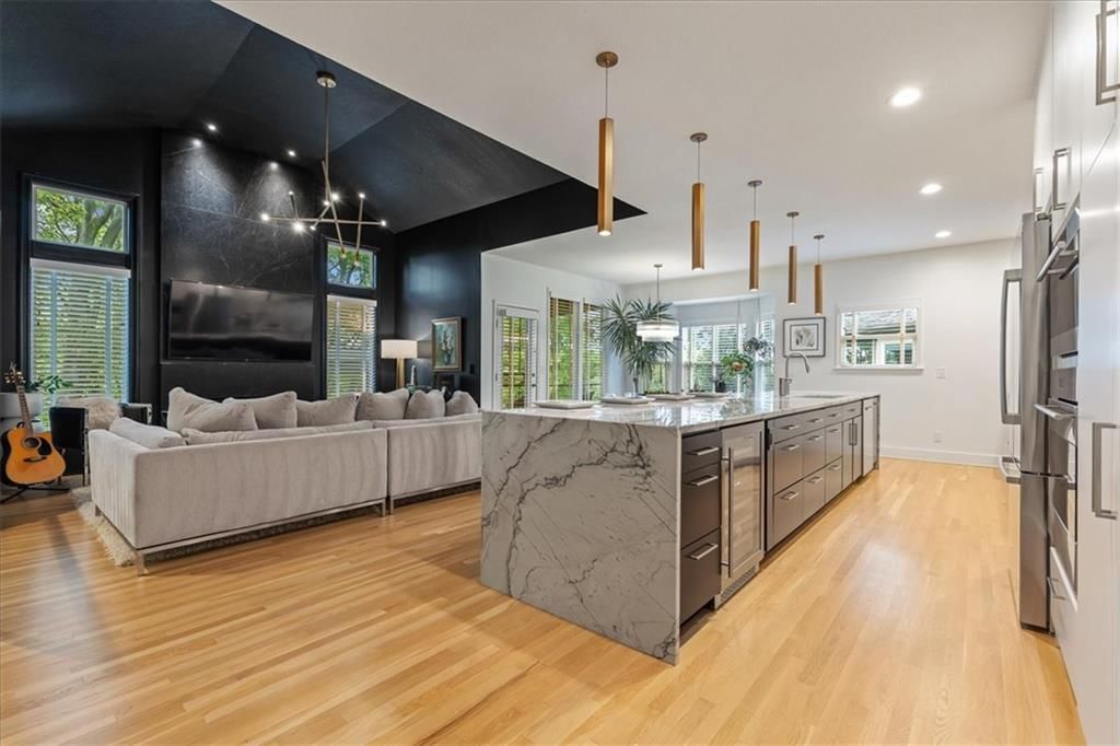Modern, tall ceilings and statement lighting at 13725 Pembroke Circle, Leawood, KS 66224