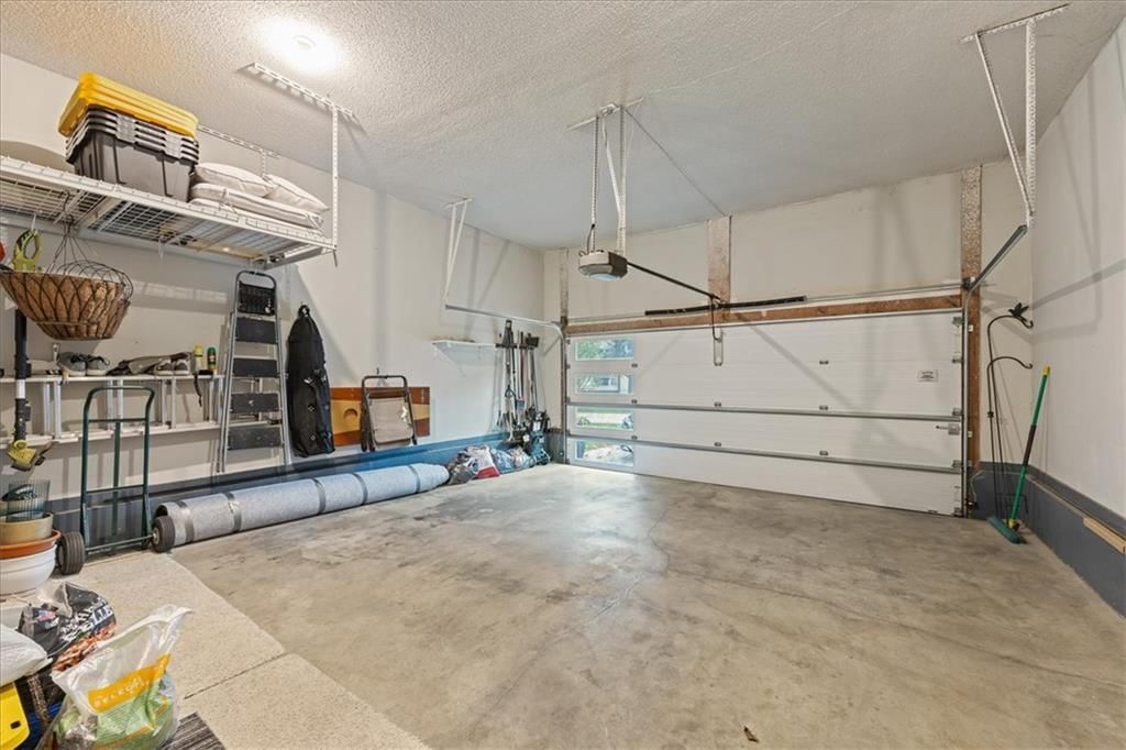 Garage storage system and attached garage at 13725 Pembroke Circle, Leawood, KS 66224