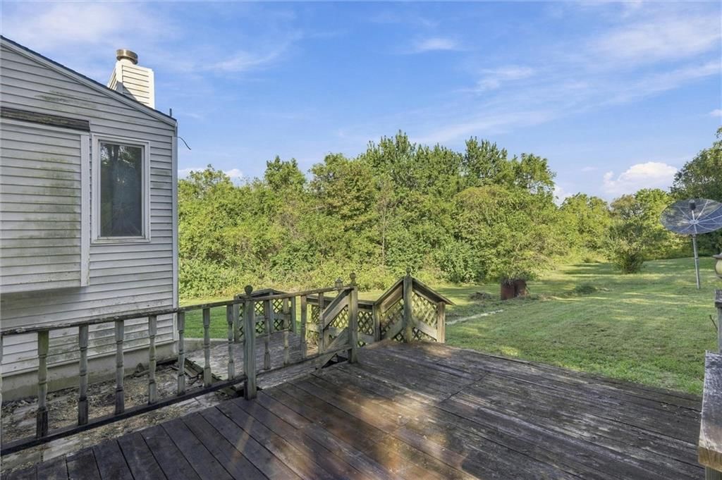 Deck, big backyard and flat lot at 23900 E State Route EE Highway, Harrisonville, MO 64701