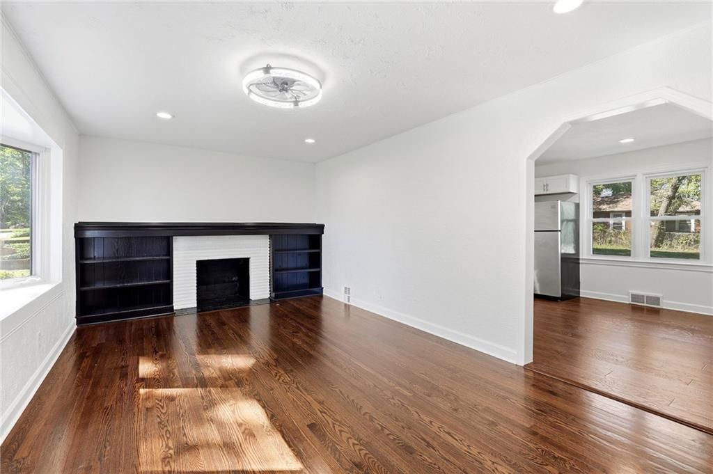 Fireplace and hardwood floors at 11216 W 61ST Place, Shawnee, KS 66203