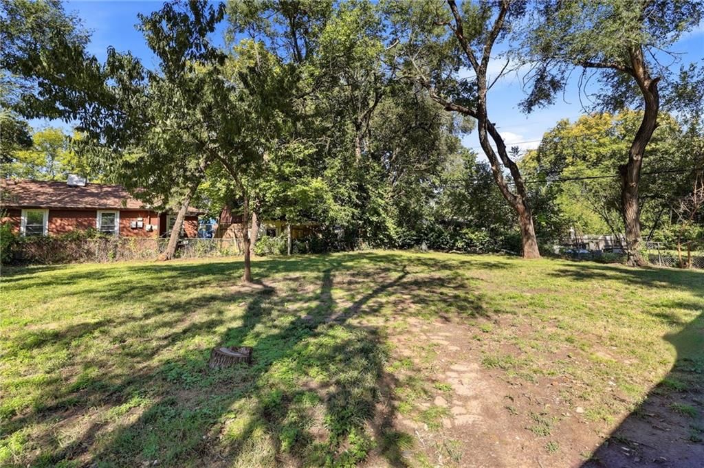 Big backyard, fenced yard and mature trees at 11216 W 61ST Place, Shawnee, KS 66203
