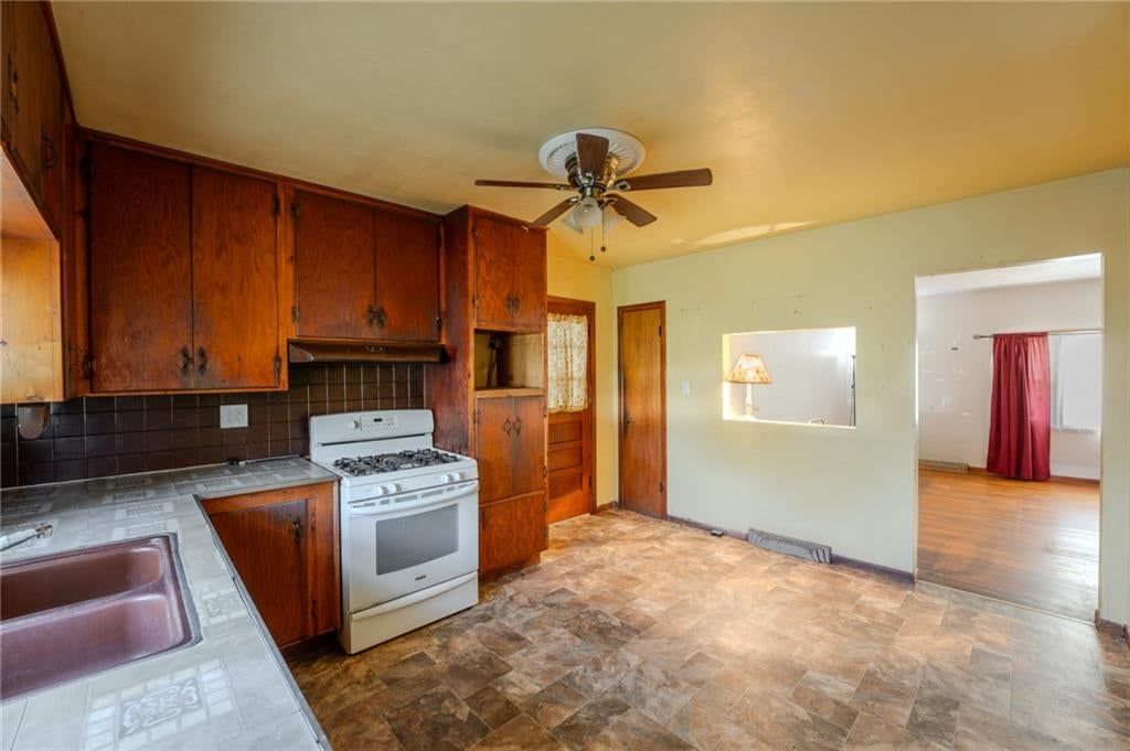 Kitchen open to the living area at 1135 S 55th Street, Kansas City, KS 66007