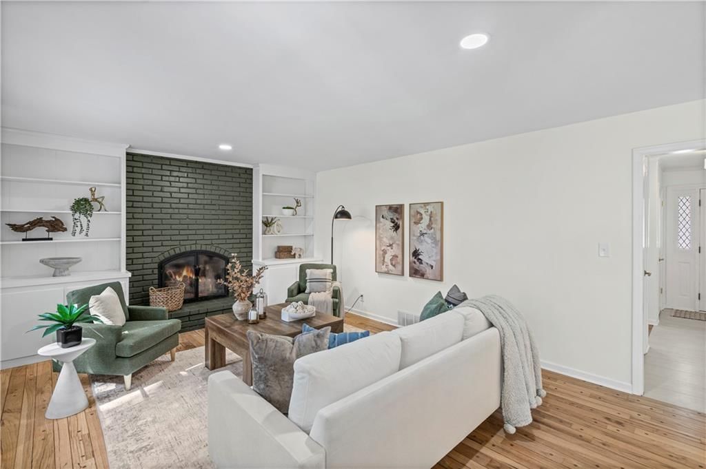 Fireplace and hardwood floors at 5419 W 100th Terrace, Overland Park, KS 66207