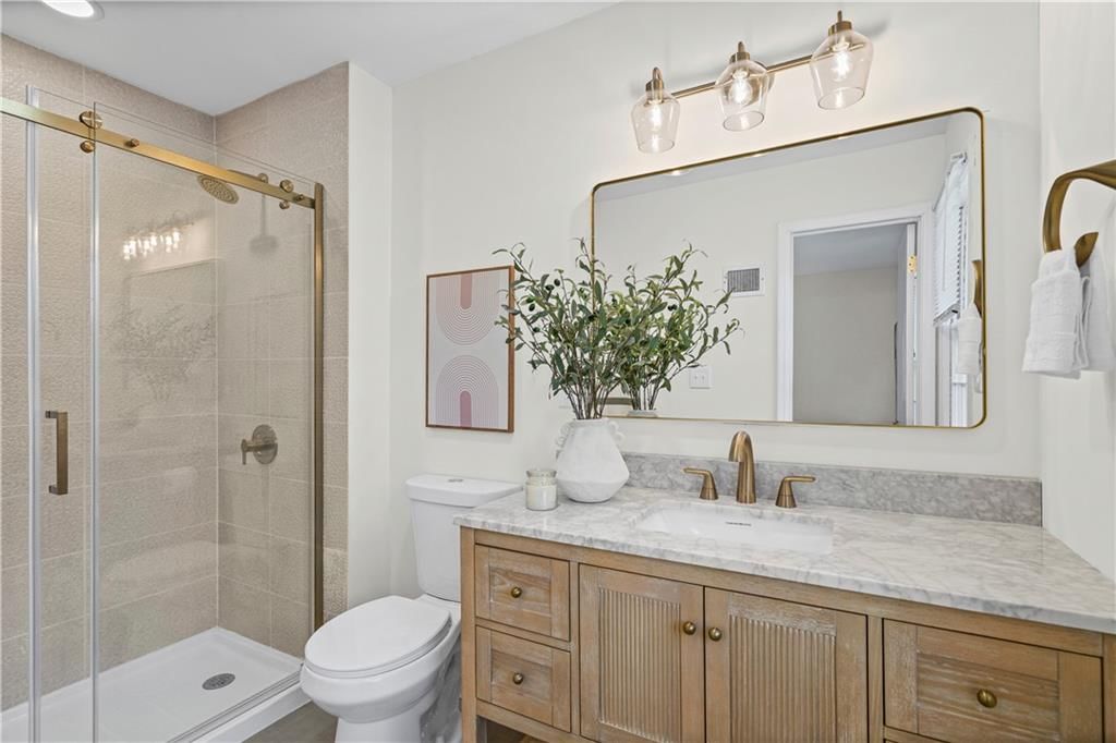 Walk-in shower and tiled shower at 5419 W 100th Terrace, Overland Park, KS 66207