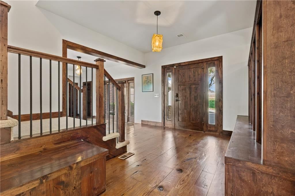 Statement lighting, staircase and iron stair railing at 20540 Pflumm Road, Bucyrus, KS 66013