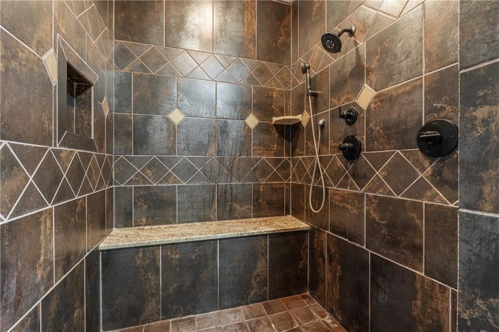 Walk-in shower and tiled shower at 20540 Pflumm Road, Bucyrus, KS 66013