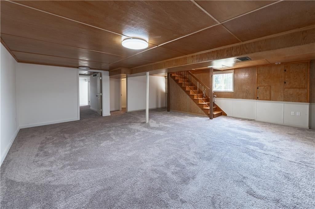 Finished basement, staircase and iron stair railing at 5820 N Lenox Avenue, Kansas City, MO 64151