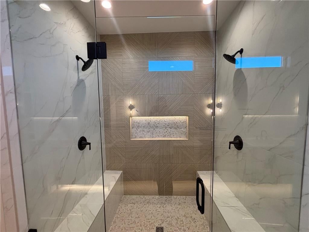 Walk-in shower, tiled shower and frameless glass shower at 9714 W 175th Terrace, Overland Park, KS 66221