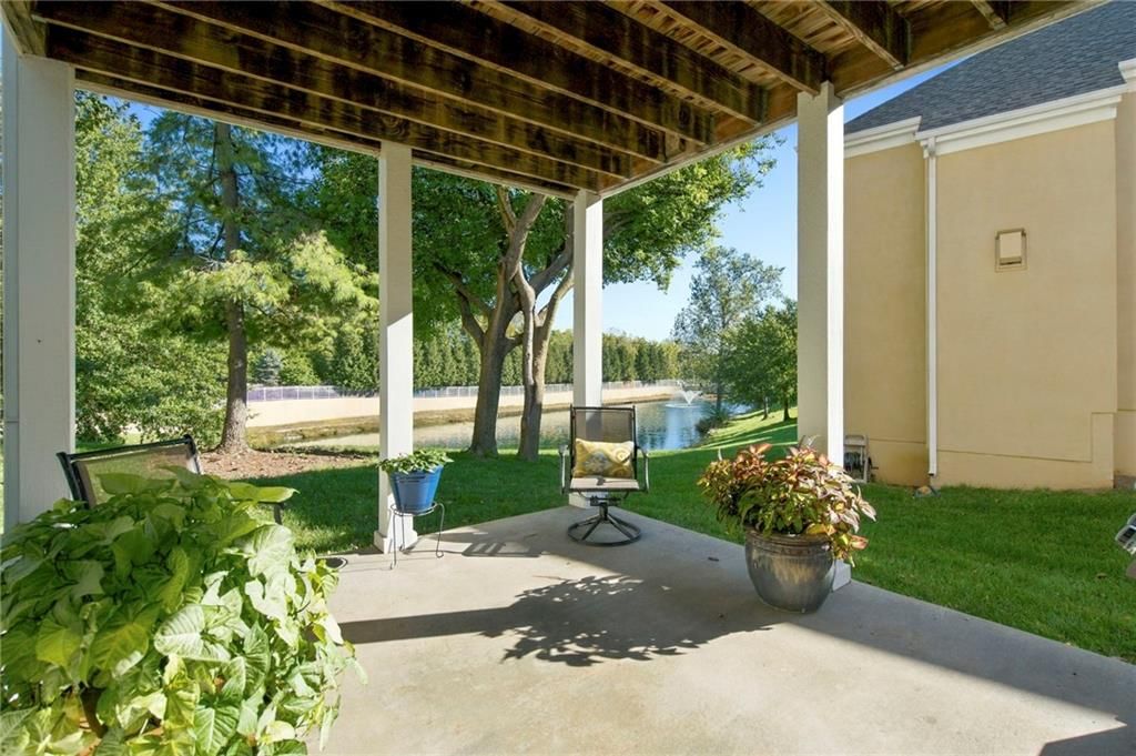 Pond or creek visible on the lot, big backyard and covered patio at 624 W 131 Terrace, Kansas City, MO 64145
