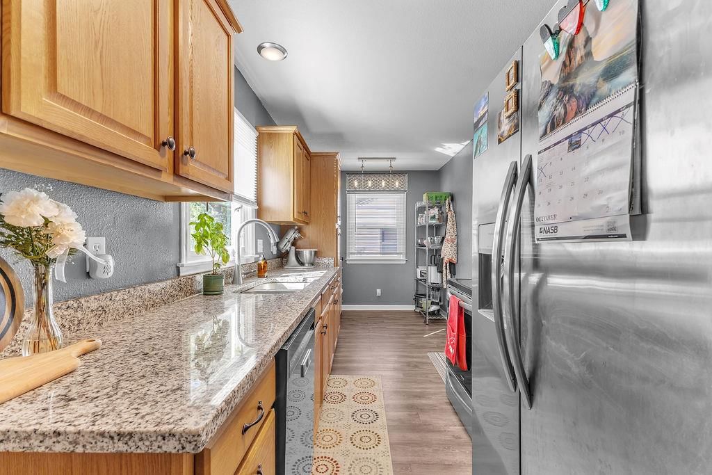 Granite counters and stainless steel appliances at 6702 N CHARLOTTE Street, Gladstone, MO 64118