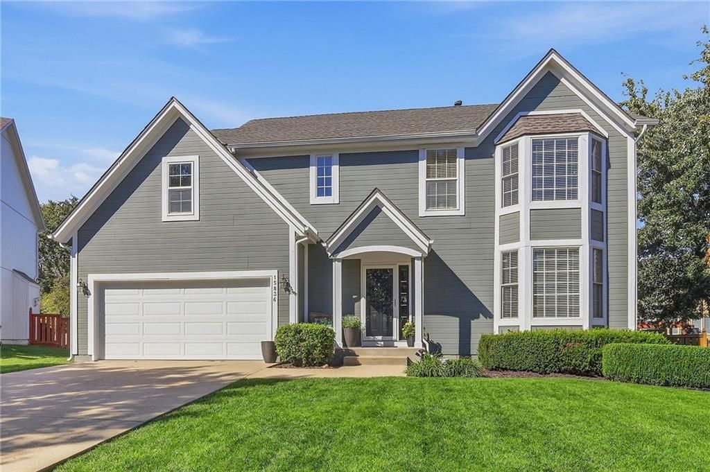 Attached garage and concrete driveway at 15836 W 153rd Terrace, Olathe, KS 66062