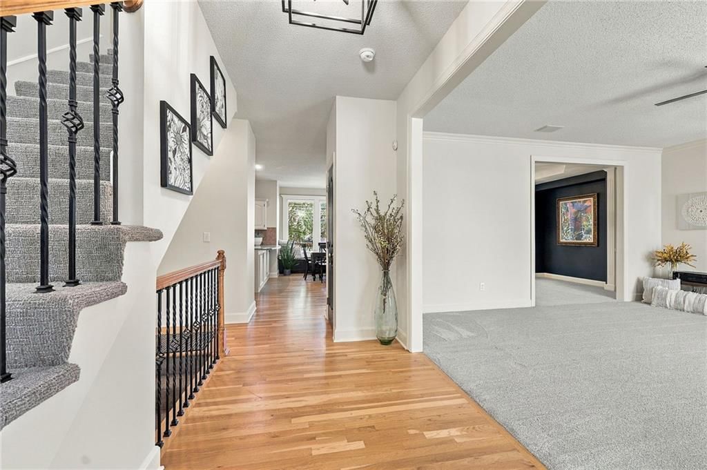 Hardwood floors, staircase and white trim at 15836 W 153rd Terrace, Olathe, KS 66062