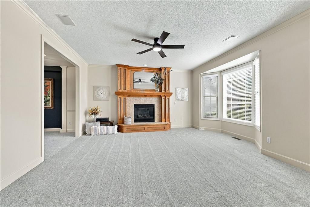 Fireplace and wall of windows at 15836 W 153rd Terrace, Olathe, KS 66062