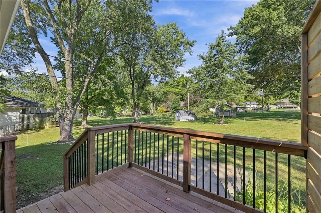 Big backyard, fenced yard and mature trees at 205 SW Kingscross Road, Blue Springs, MO 64014