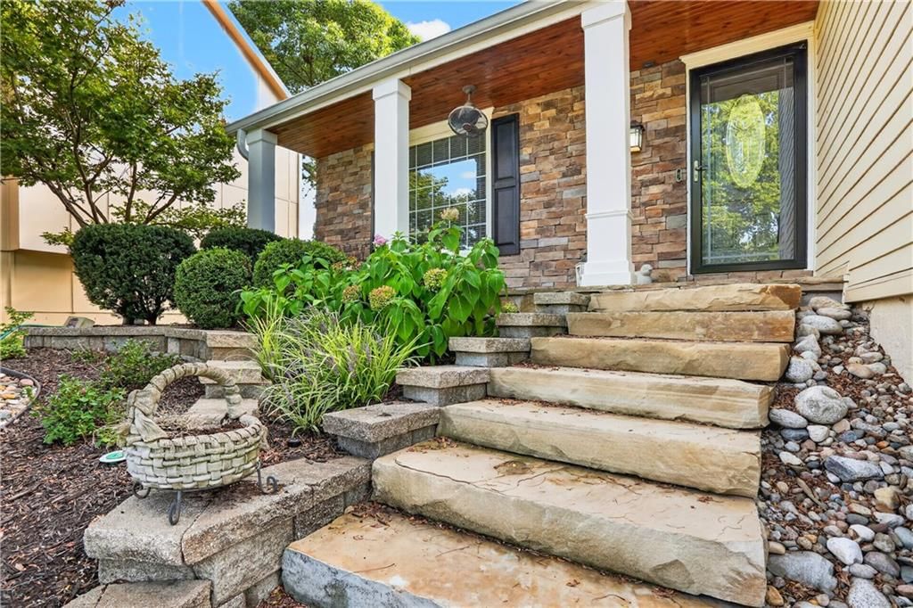 Covered front porch at 14813 W 83rd Terrace, Lenexa, KS 66215