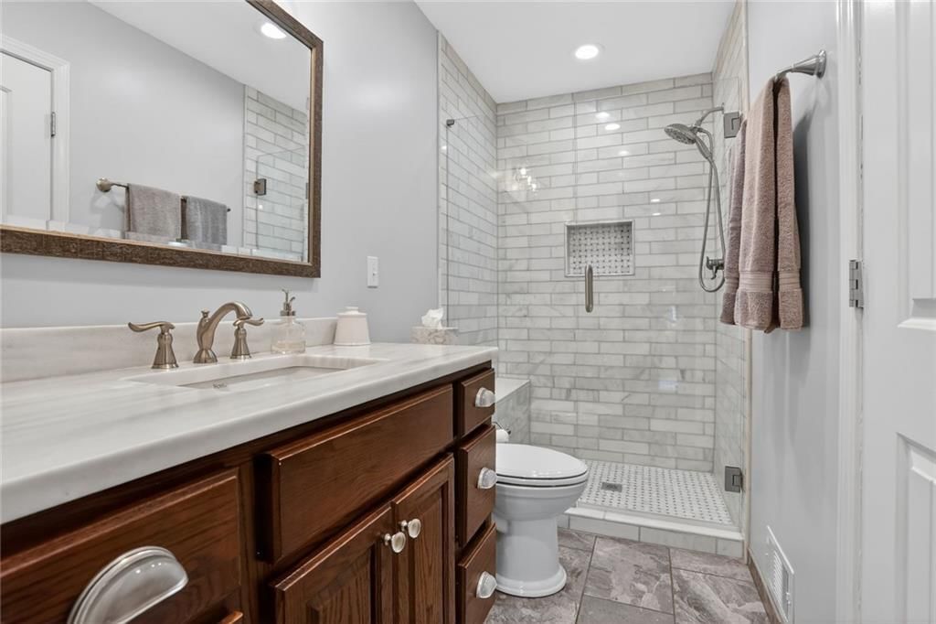 Walk-in shower and tiled shower at 14813 W 83rd Terrace, Lenexa, KS 66215