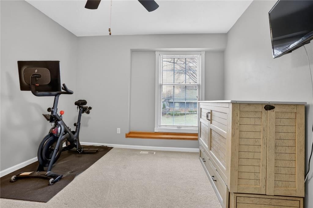 Home gym and carpet at 14813 W 83rd Terrace, Lenexa, KS 66215
