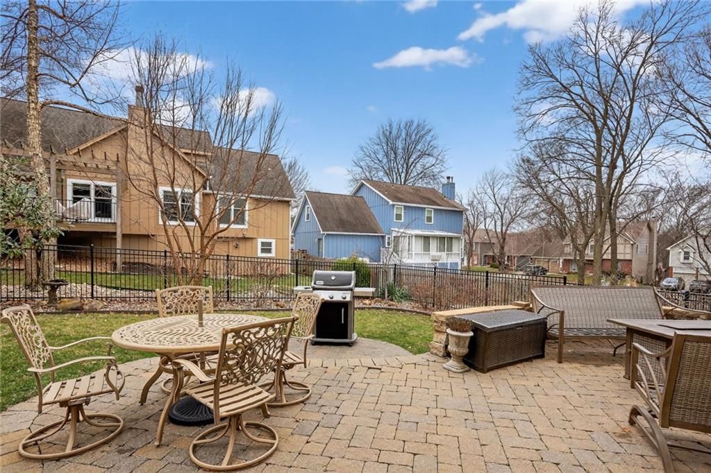 Fenced yard, iron fence and flat lot at 14813 W 83rd Terrace, Lenexa, KS 66215