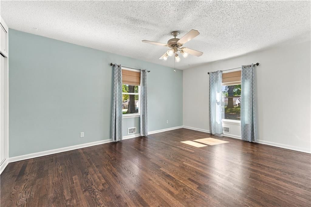 Main-floor primary bedroom at 12004 E 48th Street S, Kansas City, MO 64133