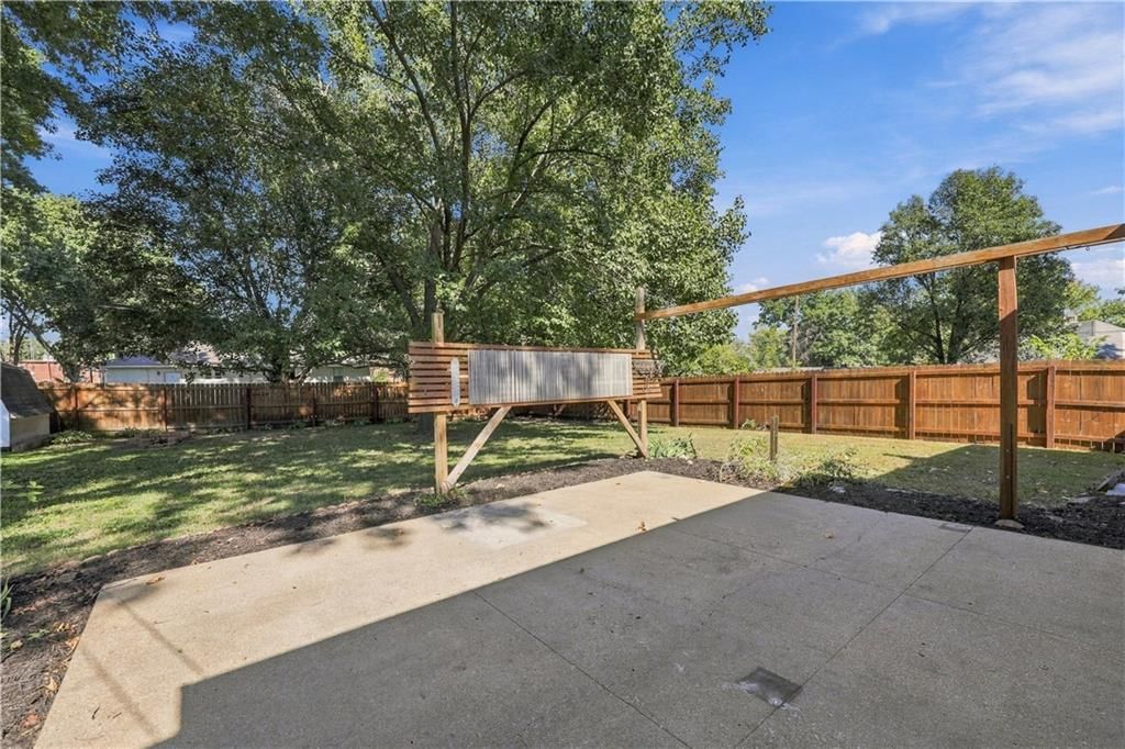 Big backyard, fenced yard and mature trees at 12004 E 48th Street S, Kansas City, MO 64133