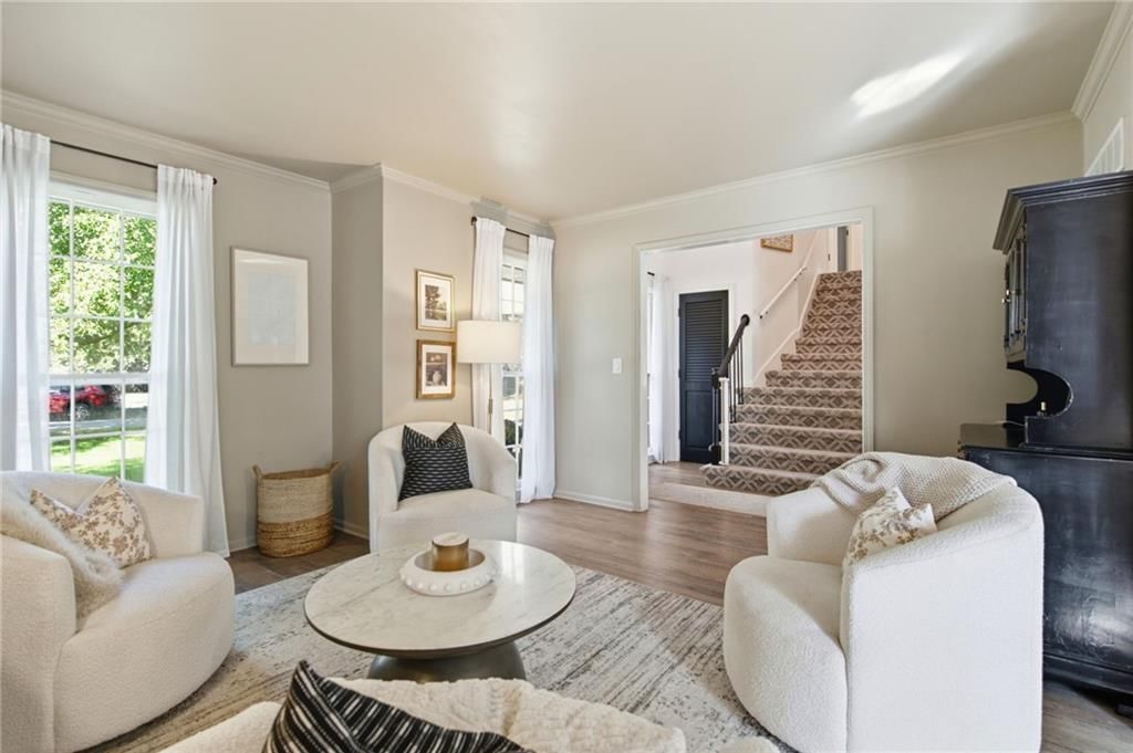 Engineered wood floors, white trim and greige walls at 206 NE Shoreview Drive, Lee's Summit, MO 64064