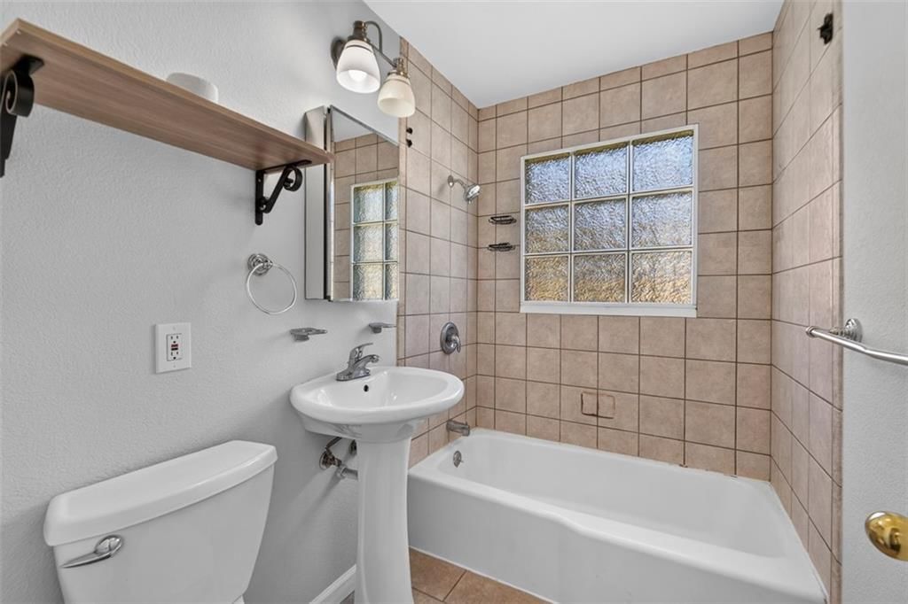 Tiled shower at 3211 Berry Road, Kansas City, KS 66106