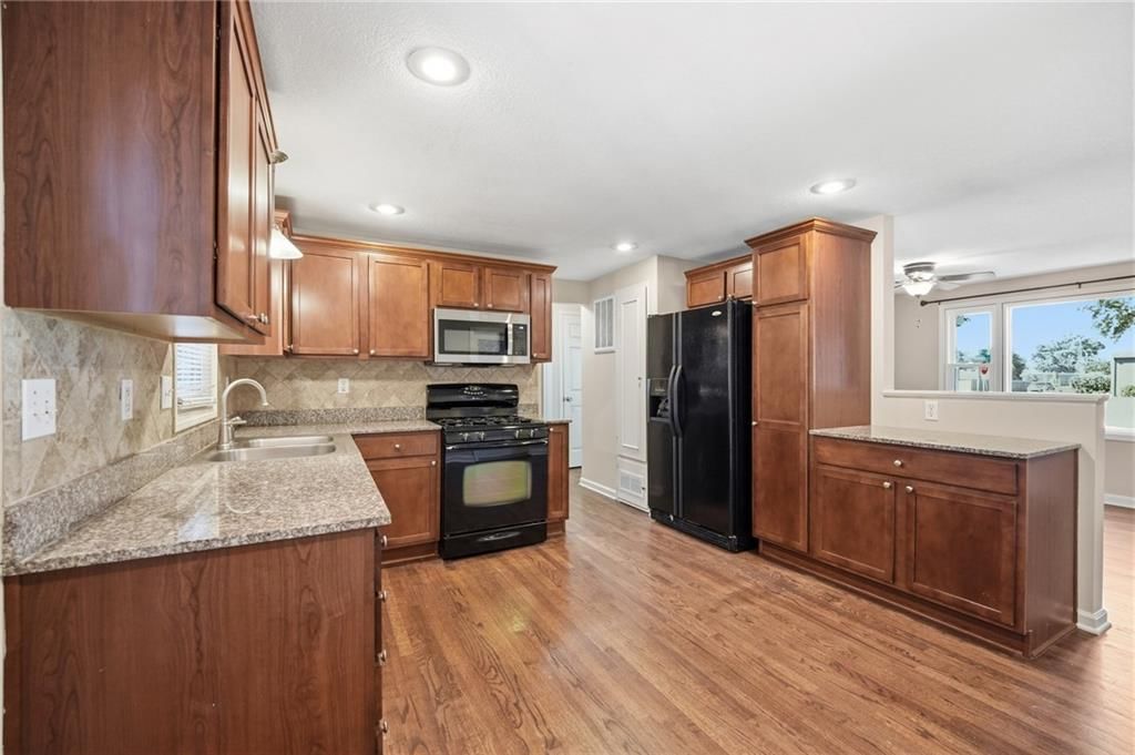Wood kitchen cabinets at 7049 Horton Street, Overland Park, KS 66204