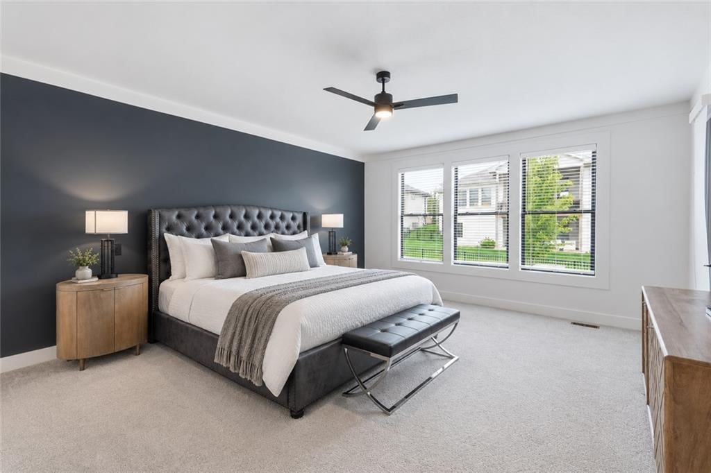 Main-floor primary bedroom and accent wall at 12602 W 169 Terrace, Overland Park, KS 66221