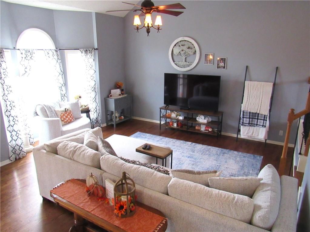 Hardwood floors and white trim at 21024 W 116th Terrace, Olathe, KS 66061