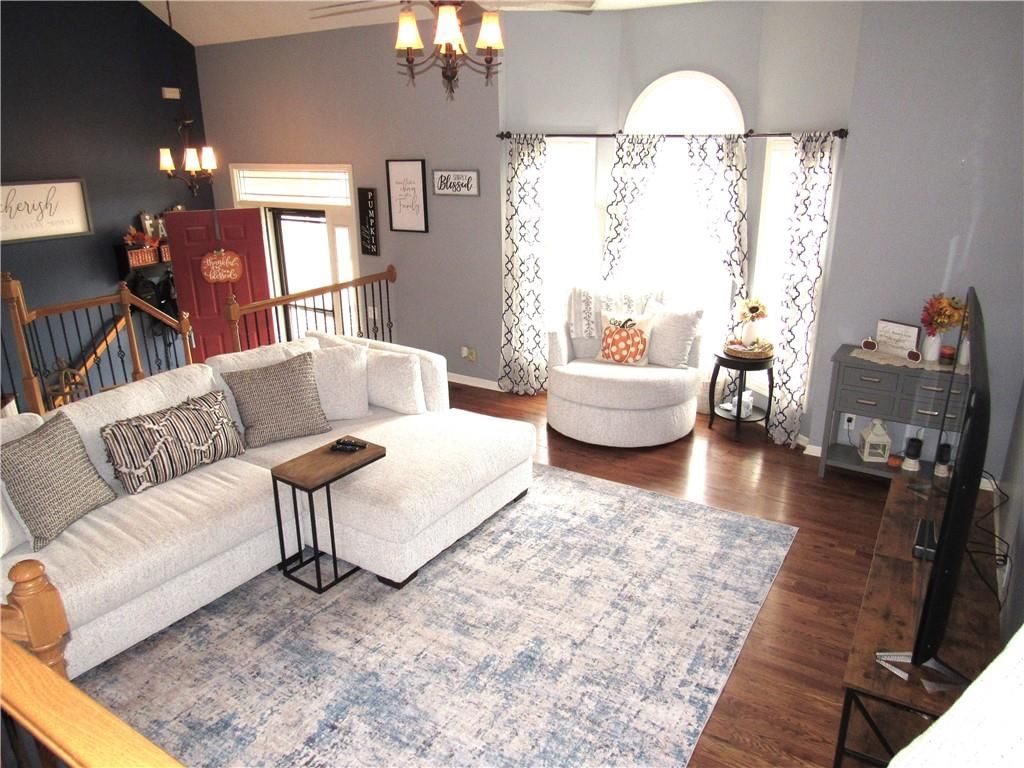 Open floor plan, staircase and iron stair railing at 21024 W 116th Terrace, Olathe, KS 66061