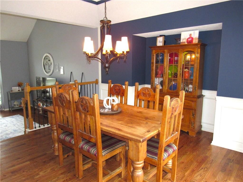 Statement lighting and wainscoting or board and batten at 21024 W 116th Terrace, Olathe, KS 66061