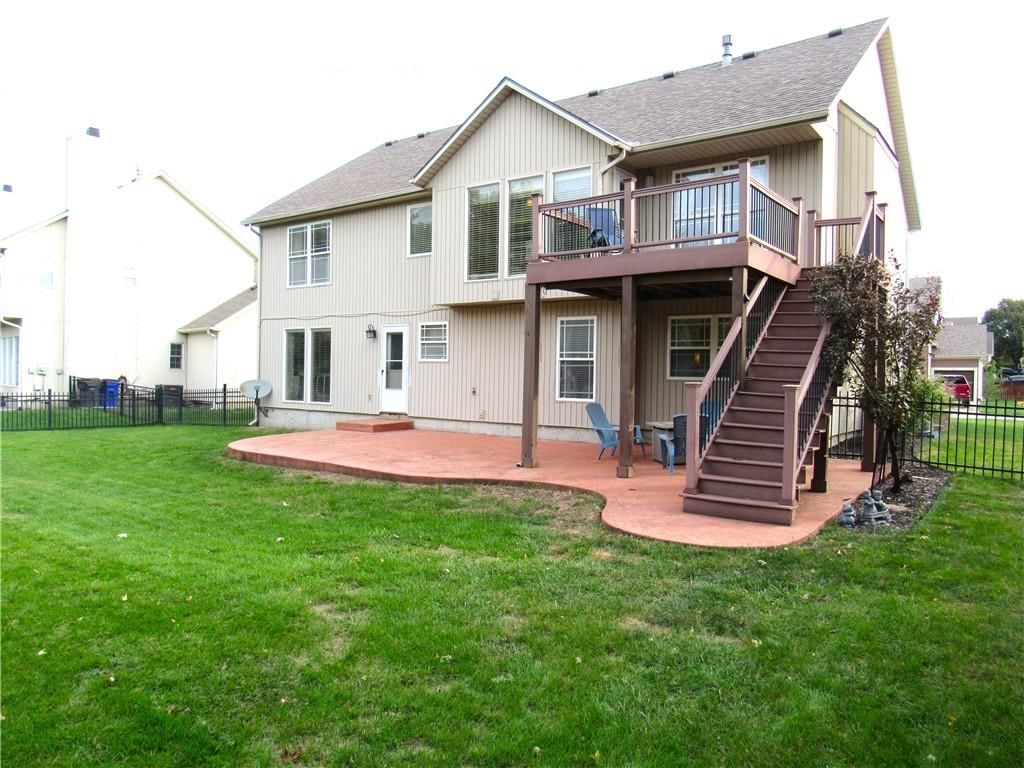 Big backyard, fenced yard and mature trees at 21024 W 116th Terrace, Olathe, KS 66061