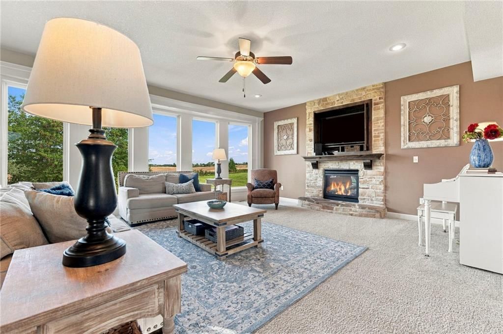 Fireplace and stone fireplace at 17700 NW 130th Terrace, Platte City, MO 64079