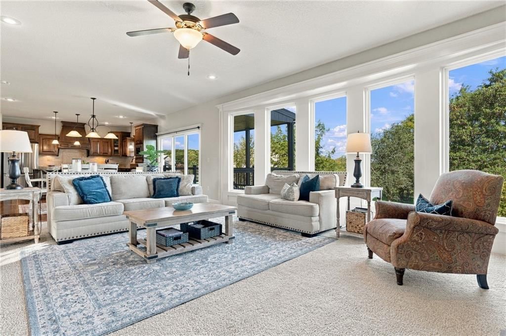 Open floor plan, wall of windows and recessed lighting at 17700 NW 130th Terrace, Platte City, MO 64079
