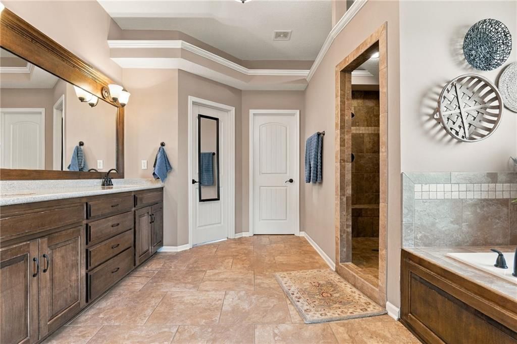 Walk-in shower and tiled shower at 17700 NW 130th Terrace, Platte City, MO 64079