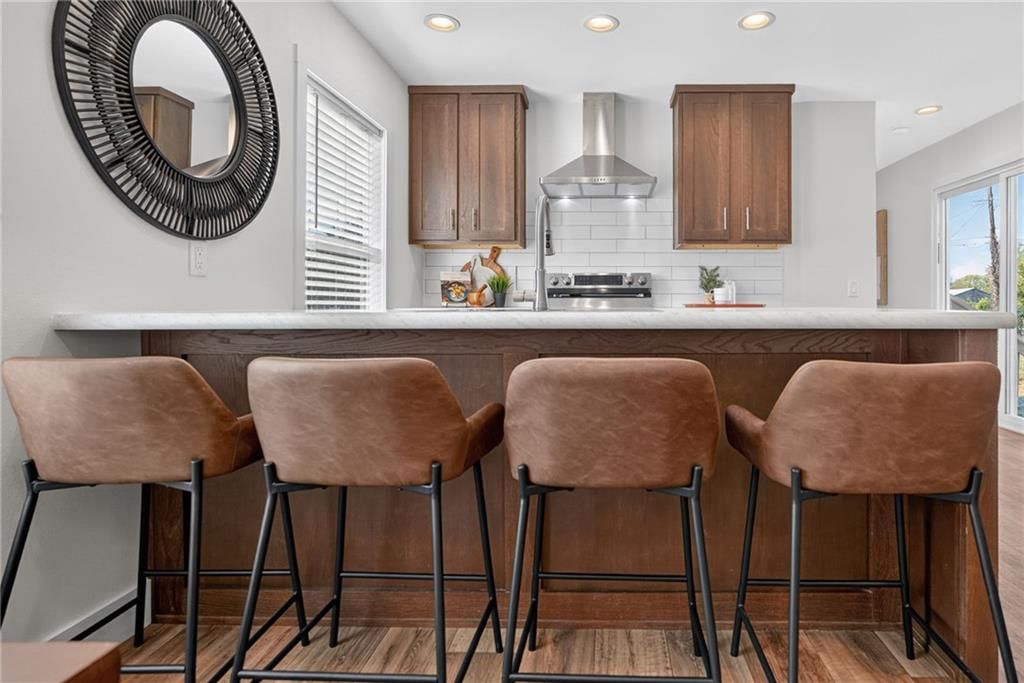 Kitchen island, shaker cabinets and wood kitchen cabinets at 2544 Hiawatha Street, Kansas City, KS 66104