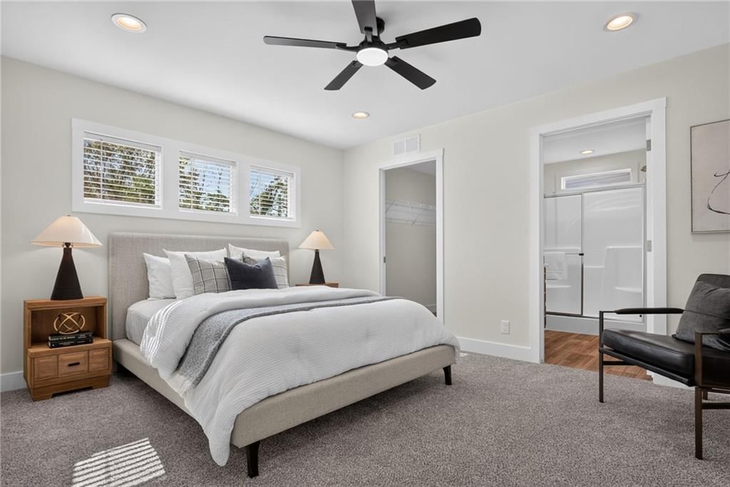 Main-floor primary bedroom and carpet at 2544 Hiawatha Street, Kansas City, KS 66104