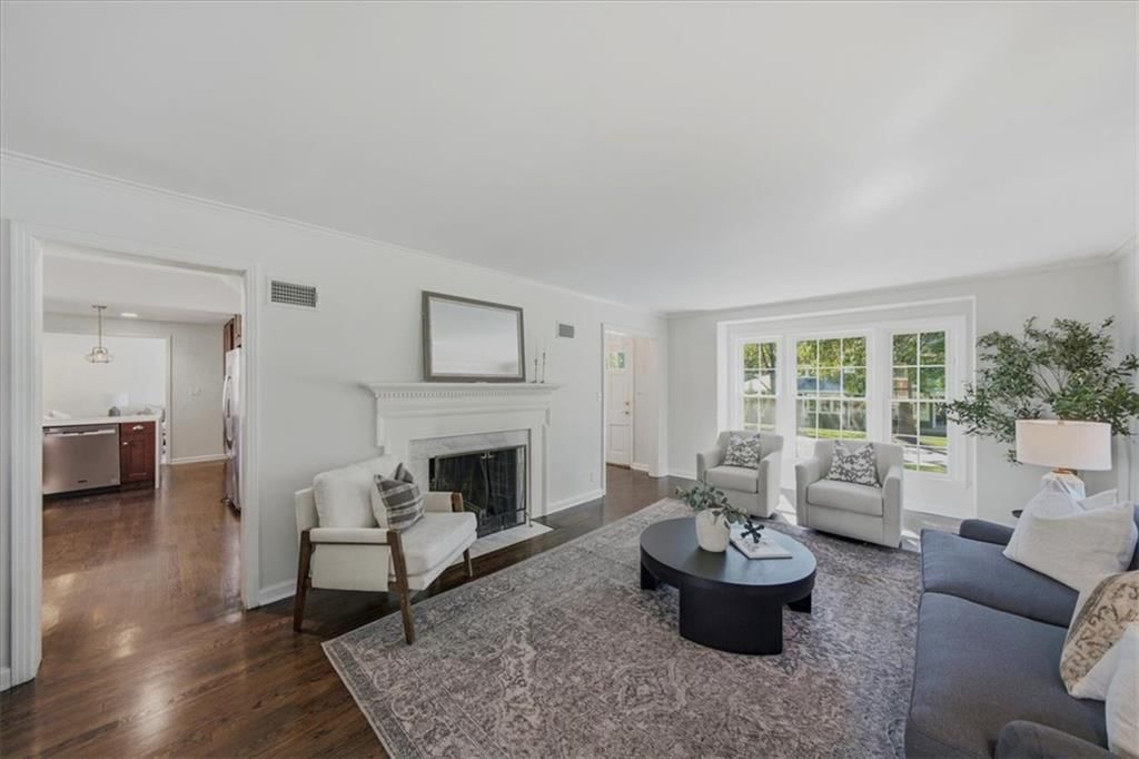 Fireplace and wall of windows at 3714 W 61st Terrace, Fairway, KS 66205