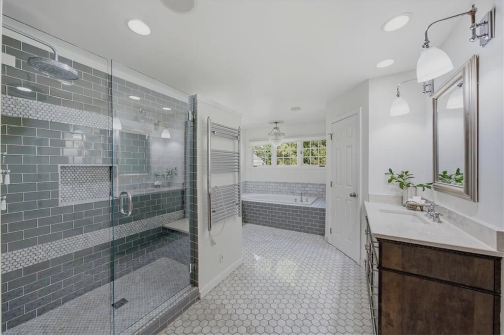Tiled shower and frameless glass shower at 3714 W 61st Terrace, Fairway, KS 66205