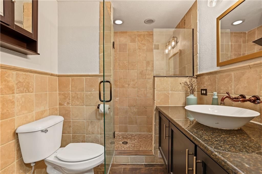 Walk-in shower, tiled shower and frameless glass shower at 1111 46th Street W #22, Kansas City, MO 64112
