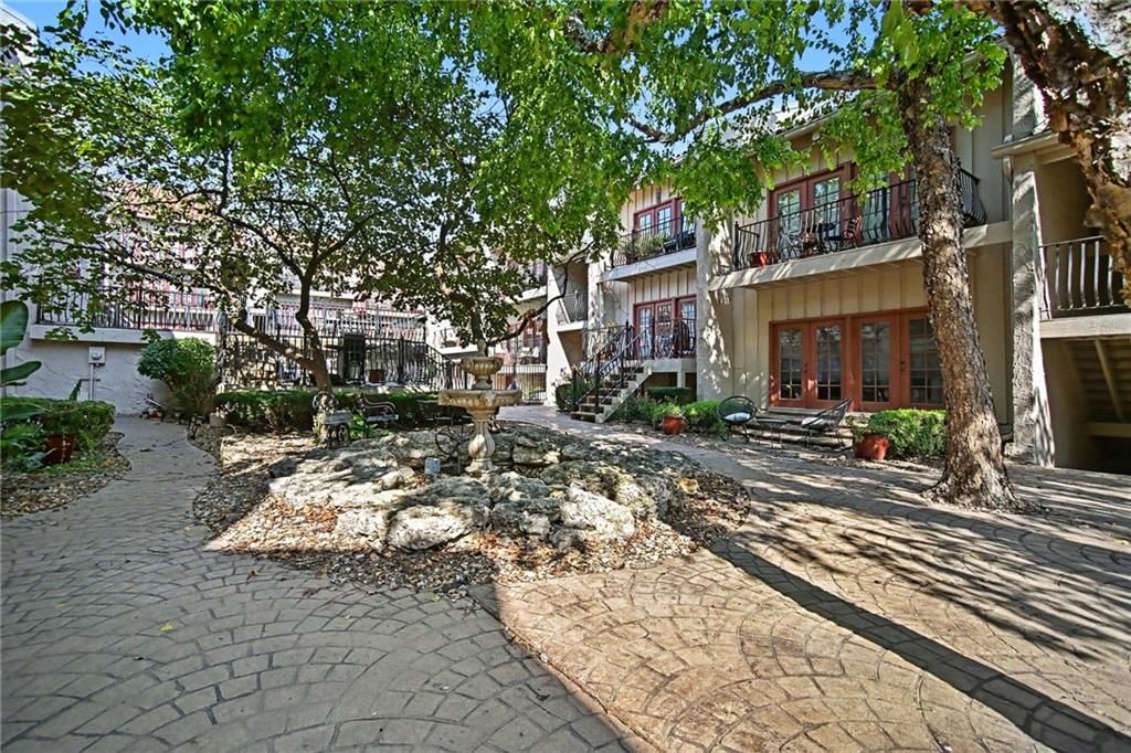 Mature trees, paver patio and flat lot at 1111 46th Street W #22, Kansas City, MO 64112