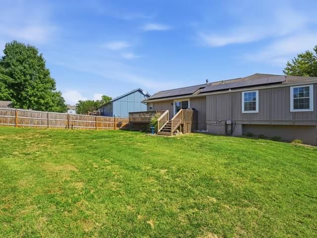 Big backyard, fenced yard and mature trees at 713 NW Rosaceae Drive, Blue Springs, MO 64015