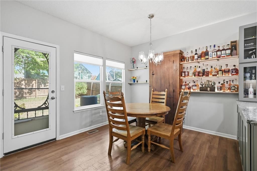 Statement lighting and breakfast nook at 20426 W 220th Terrace, Spring Hill, KS 66083