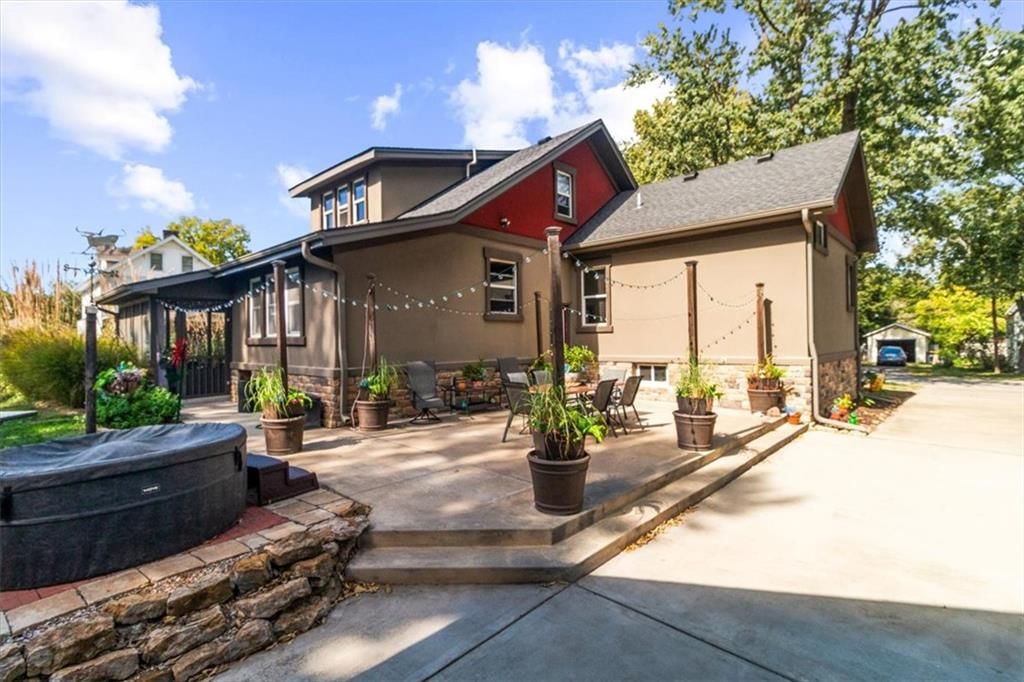 Fenced yard, fire pit and wood fence at 1608 Smith Street, Blue Springs, MO 64015