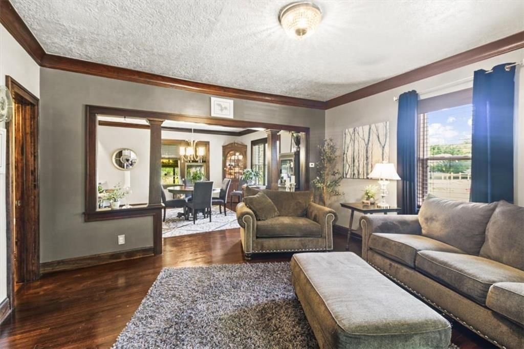 Hardwood floors and wall of windows at 1608 Smith Street, Blue Springs, MO 64015