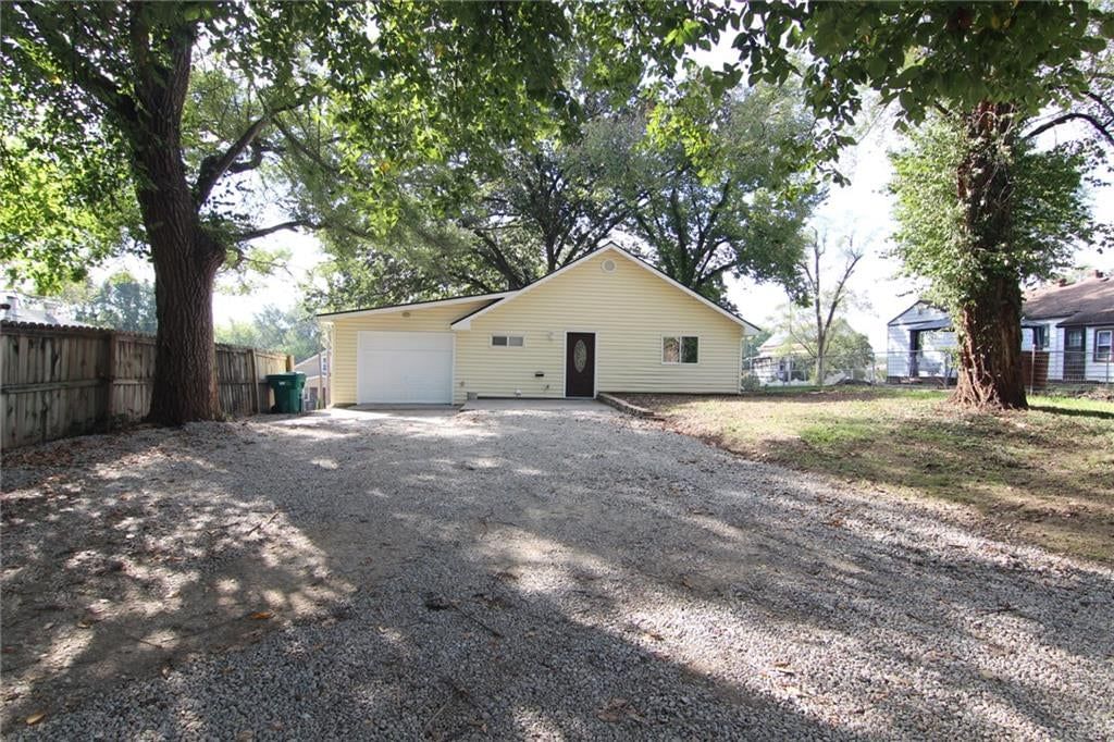 Fenced yard and attached garage at 5638 Miami Avenue, Kansas City, KS 66106