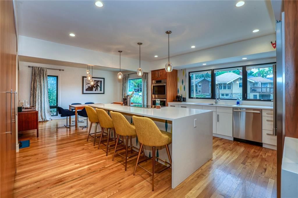 Open floor plan, kitchen island and quartz counters at 1600 W 51st Street, Kansas City, MO 64112
