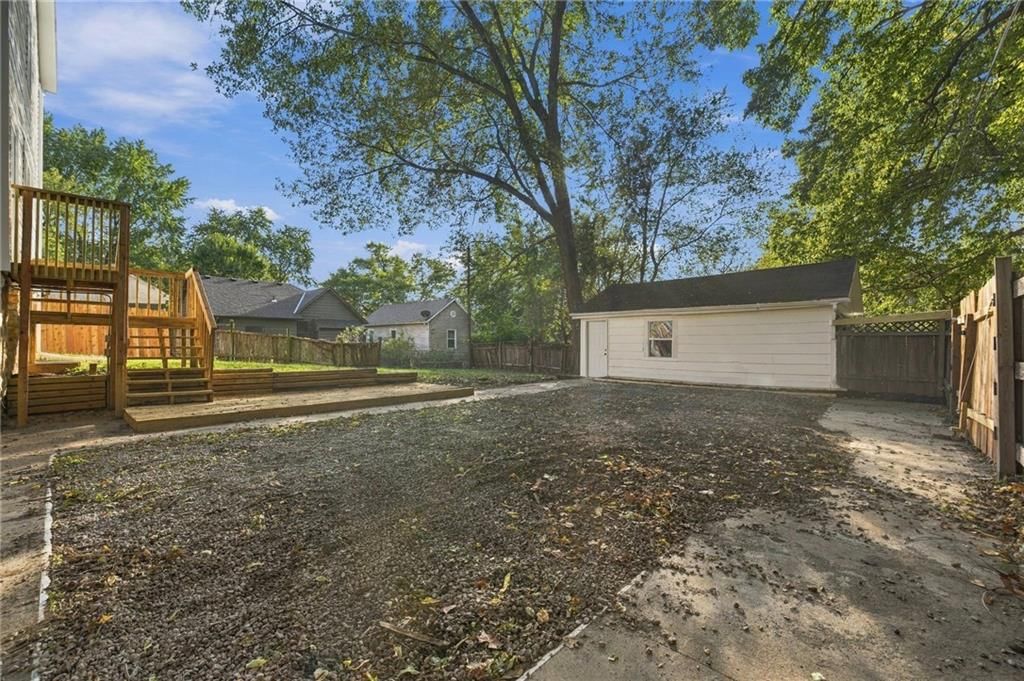 Deck, mature trees and flat lot at 720 W 7th Street, Leavenworth, KS 66048