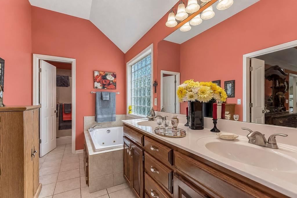 Double vanity and wood vanity at 993 Sicklebar Drive, Peculiar, MO 64078