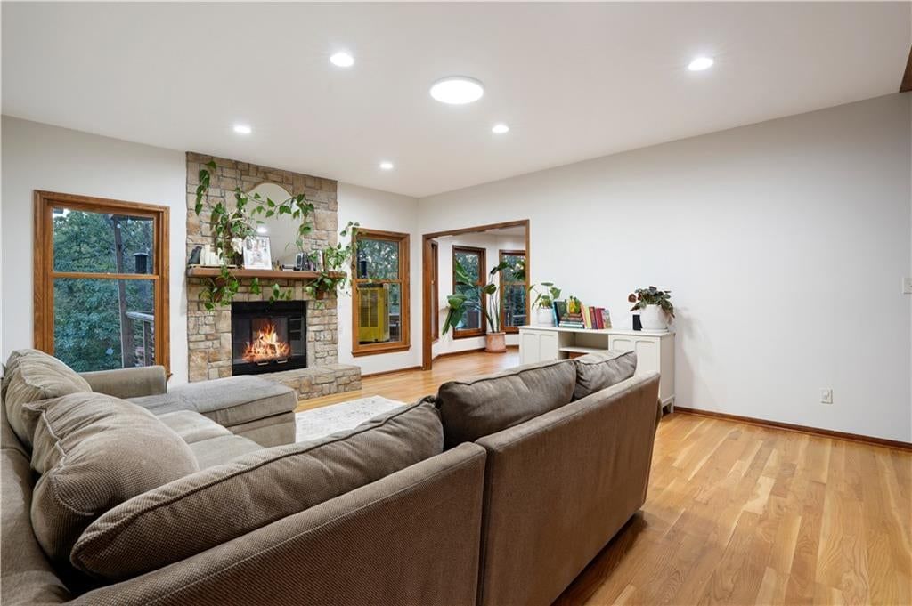 Fireplace and open floor plan at 7955 NW Bridle Parc Lane, Kansas City, MO 64152